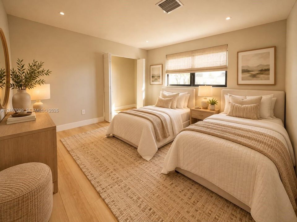Neutral-toned interior featuring wood-finish flooring, recessed lighting, and a window with integrated shade treatments