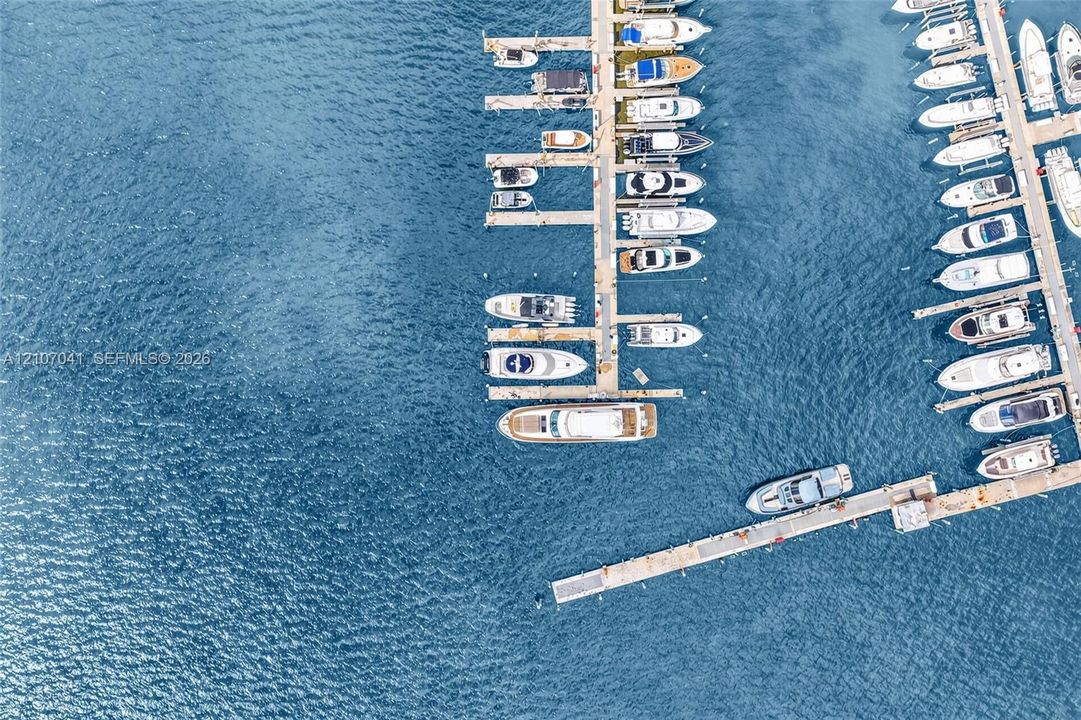 Deep-water marina featuring multi-vessel docking slips and concrete pier infrastructure