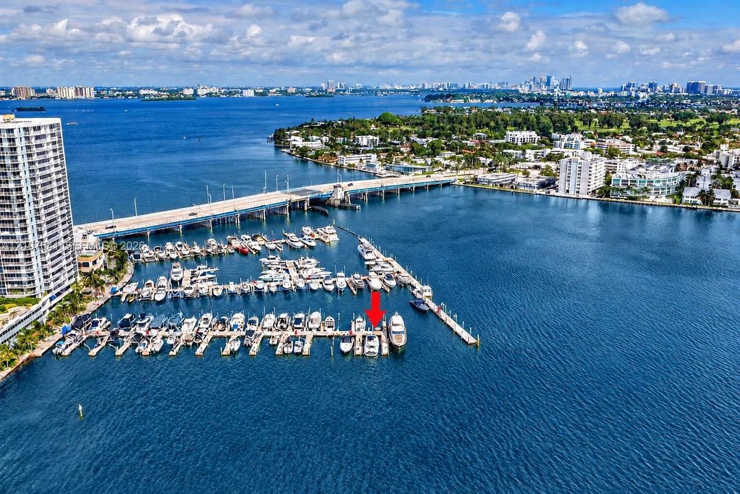 Deep-water marina slip featuring private dock access, utility connections, and direct waterway entry
