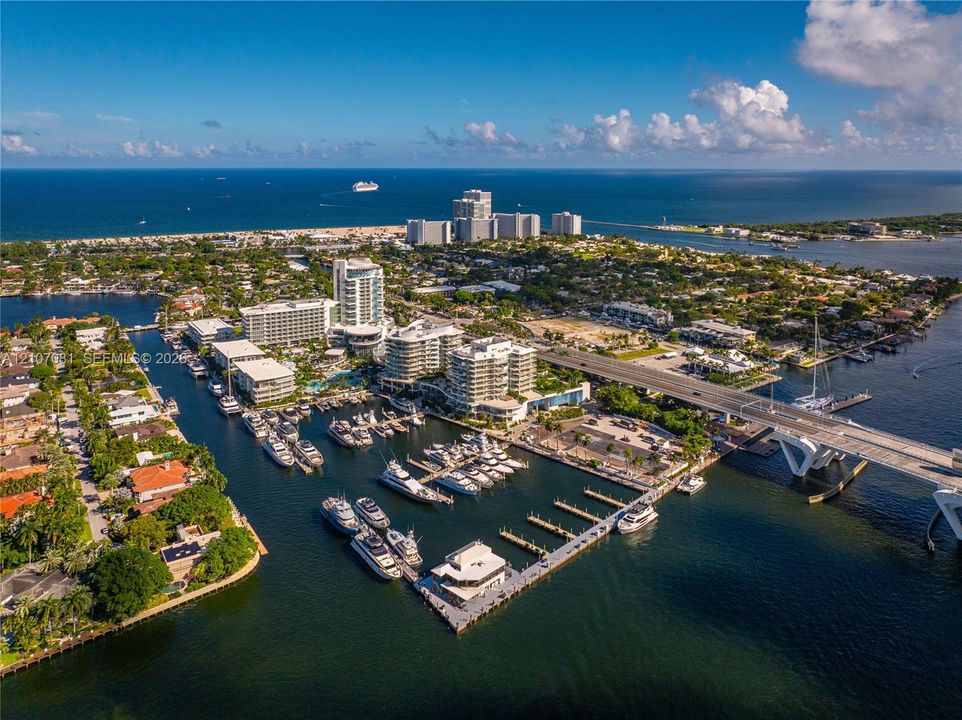 Aerial perspective of a coastal marina featuring deep-water slips, concrete docking infrastructure, and direct access to open water