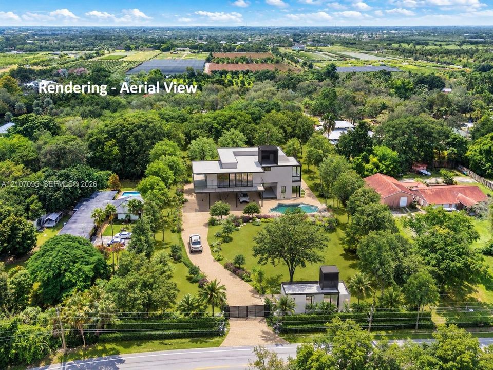 Aerial perspective of a multi-level contemporary estate featuring a paved driveway with gated entrance, an inground swimming pool, expansive grounds with mature landscaping, and a detached secondary structure