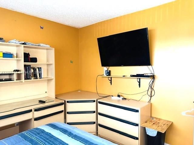 Built-in desk with overhead shelving and integrated drawer storage units