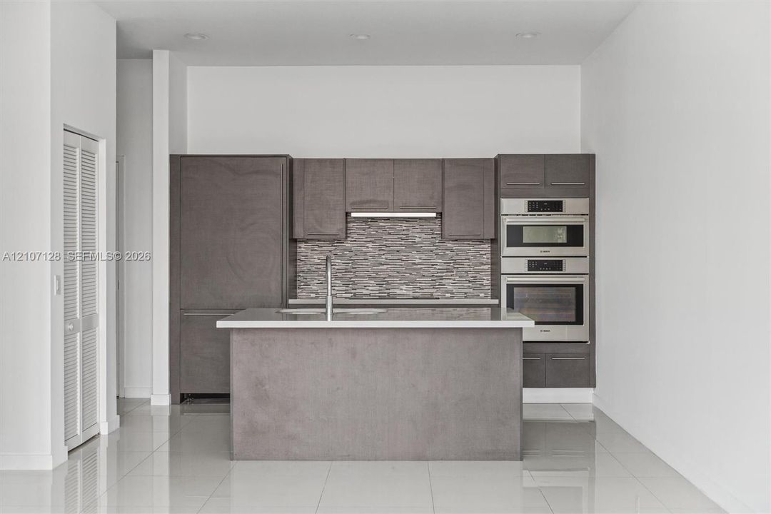 Modern kitchen viewed from the living area.