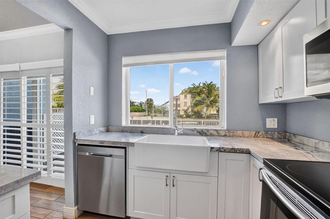 Kitchen Faces Pool & Waterfront