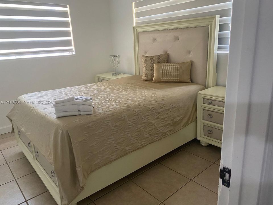 Ceramic tile flooring and dual-layer window treatments