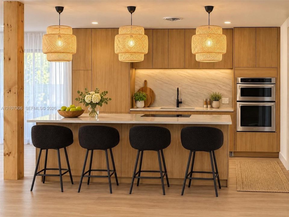 Kitchen featuring flat-panel wood cabinetry, integrated double wall ovens, a large island with stone-finish countertop, textured pendant lighting, and light-tone wood-finish flooring