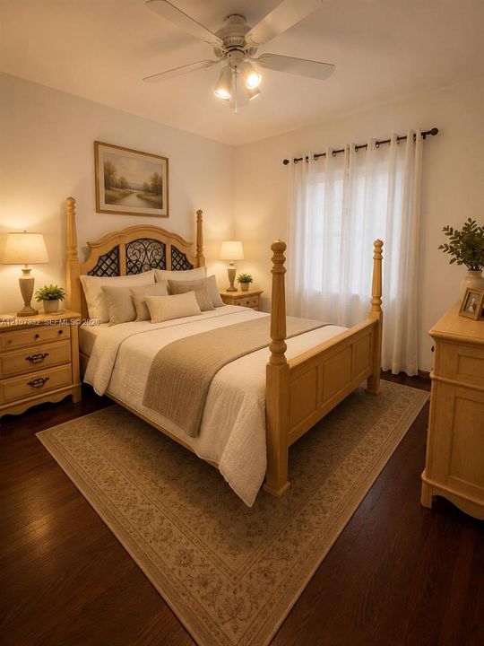 Wood-finish flooring, ceiling fan with integrated lighting, and window with curtain rod hardware
