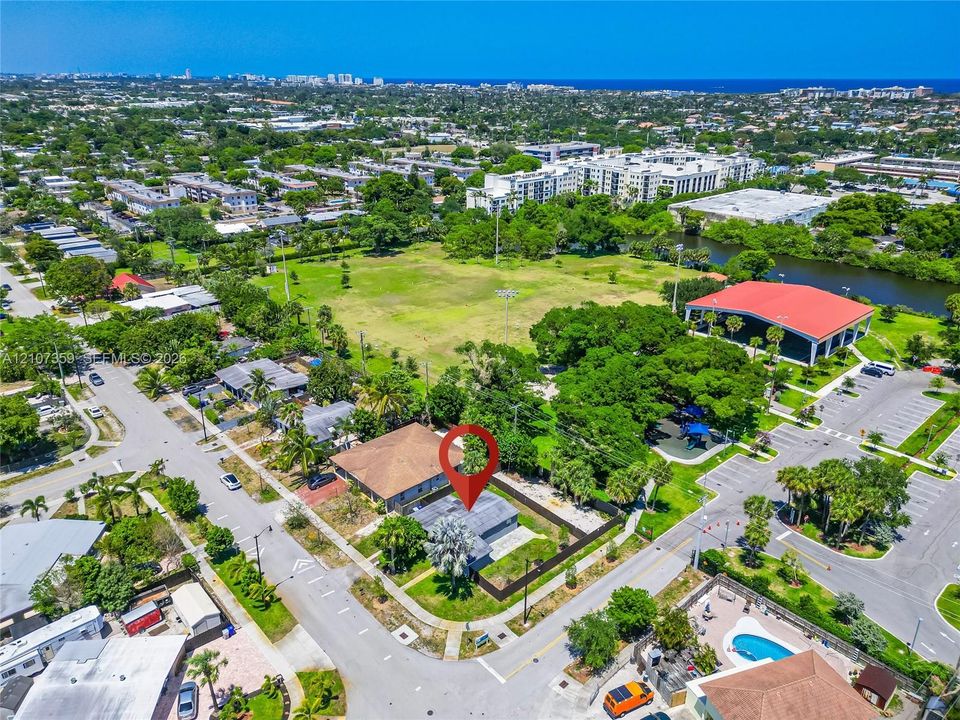 Aerial view showing the property’s location and proximity to nearby green space.