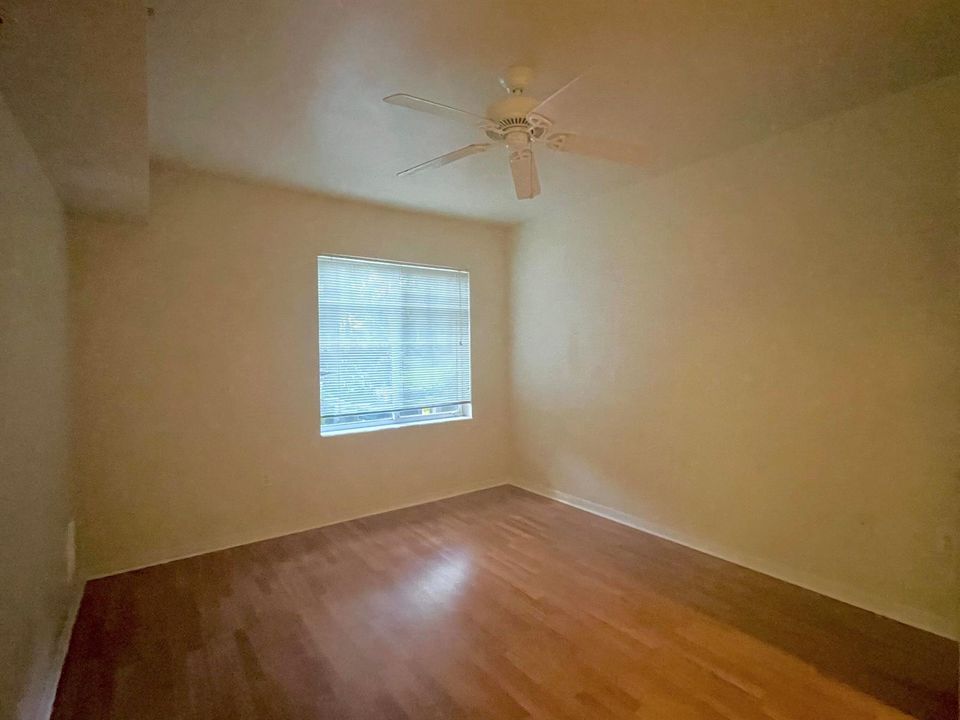 bedroom w/ laminate floor