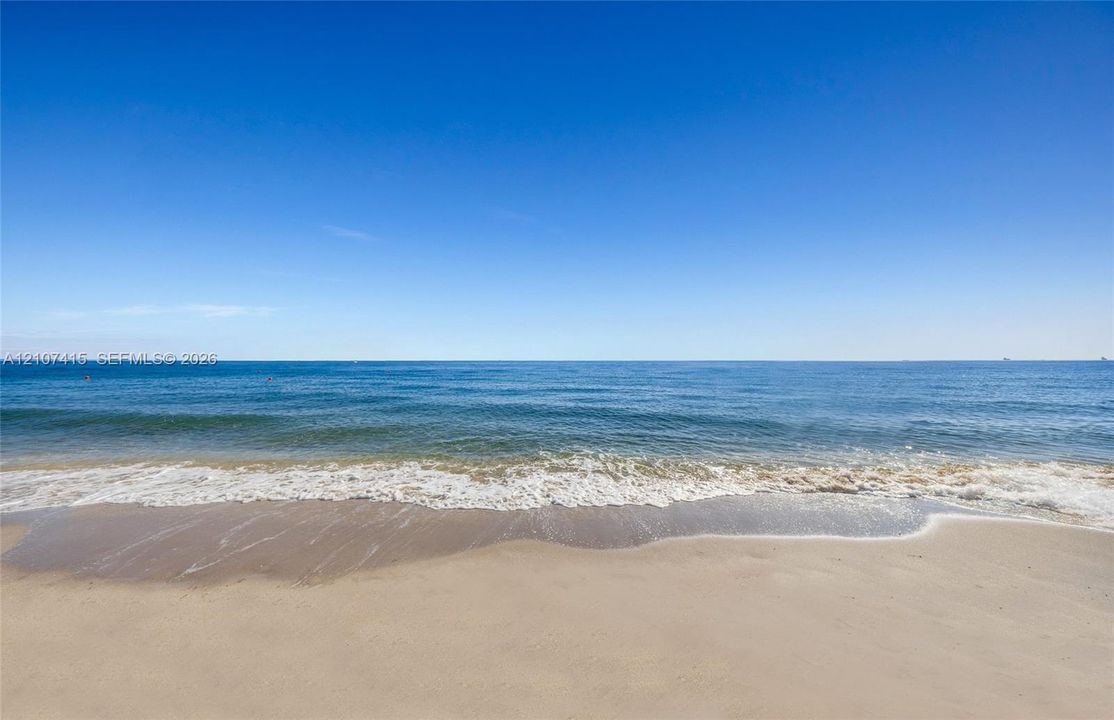 Sandy beachfront featuring immediate water access