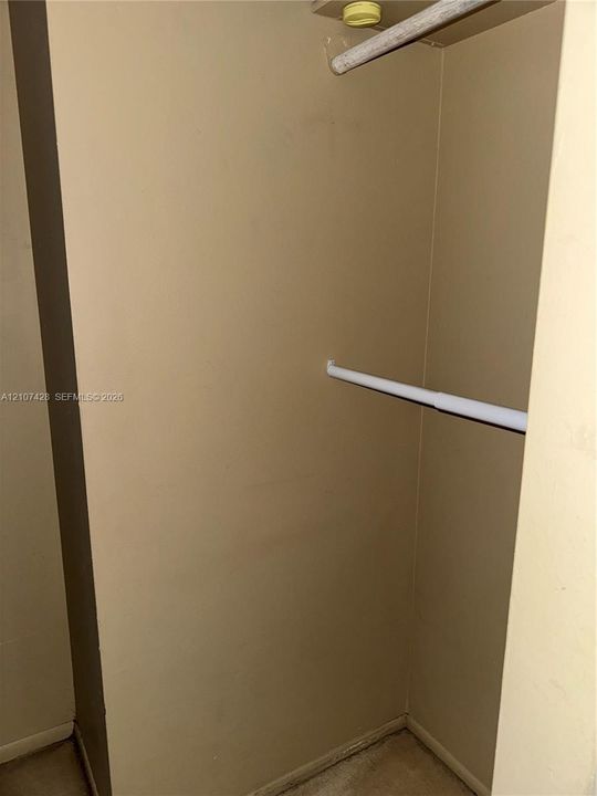 Storage space featuring dual-level hanging rods