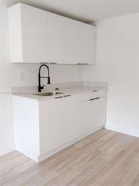Fridge, hot plate & microwave being installed.