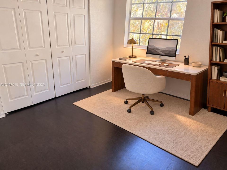 Room featuring dark wood-finish flooring, white panel-style closet doors, and a multi-pane window
