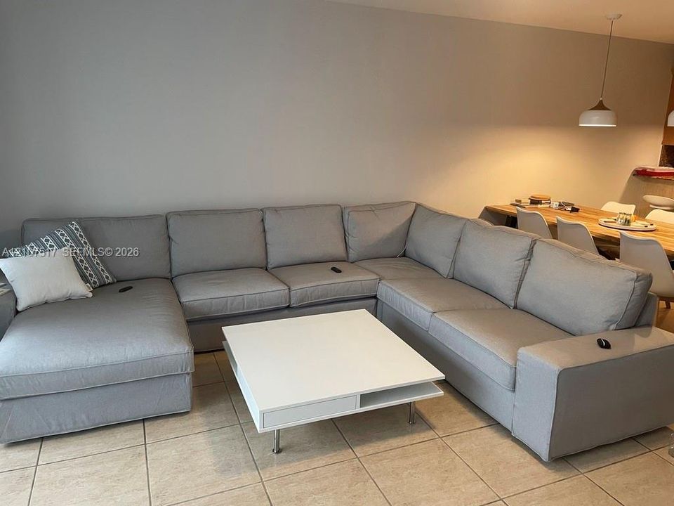 large living room fits huge sectionals with plenty of space for everyone
