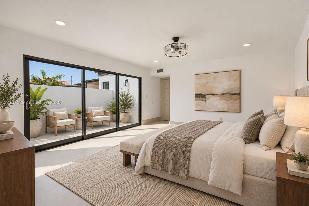 Sliding glass wall, recessed lighting, neutral interior palette, and a private patio enclosure