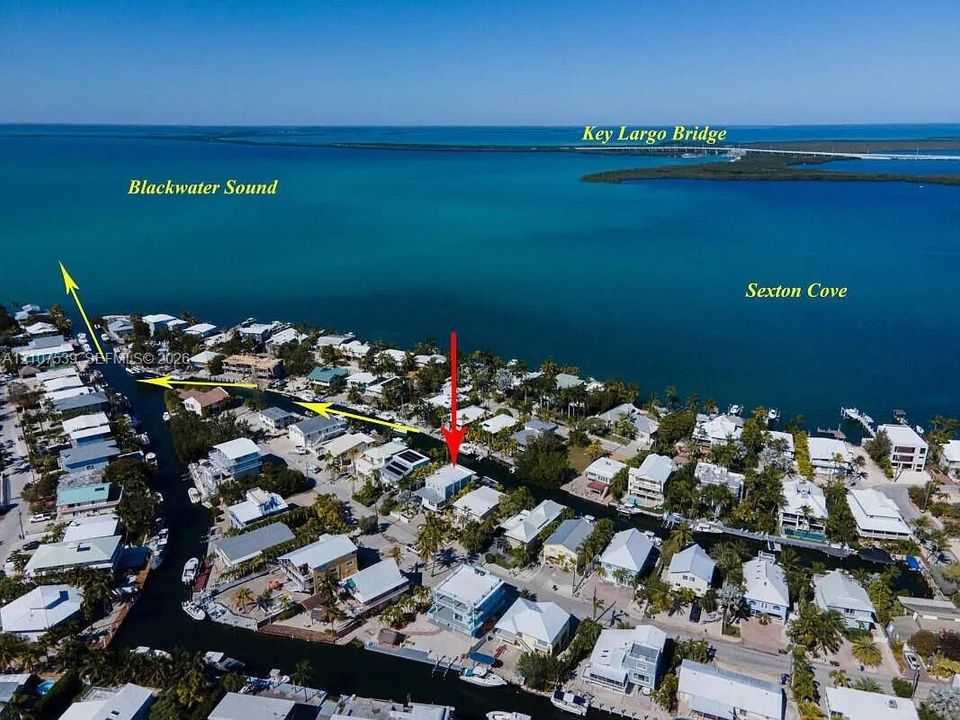 Aerial perspective of waterfront property situated on a canal with direct access to Blackwater Sound and Sexton Cove
