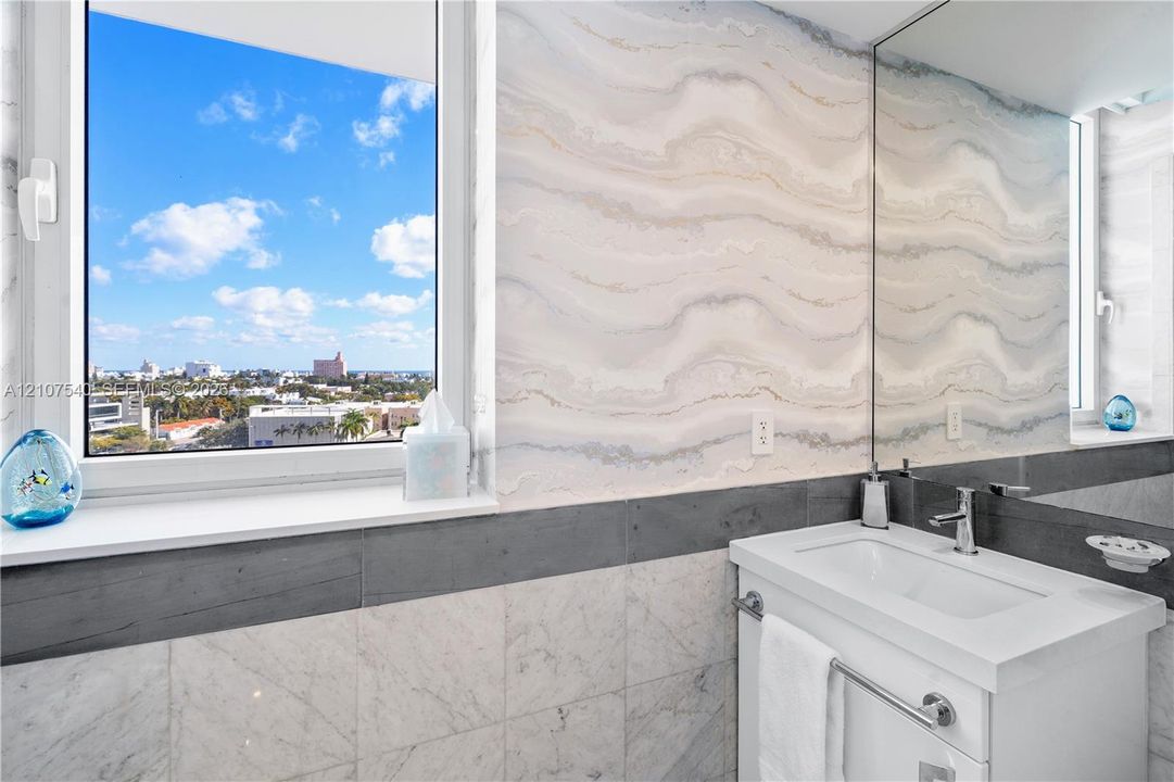 Remodeled guest bathroom with Glass framed Shower + Bathtub