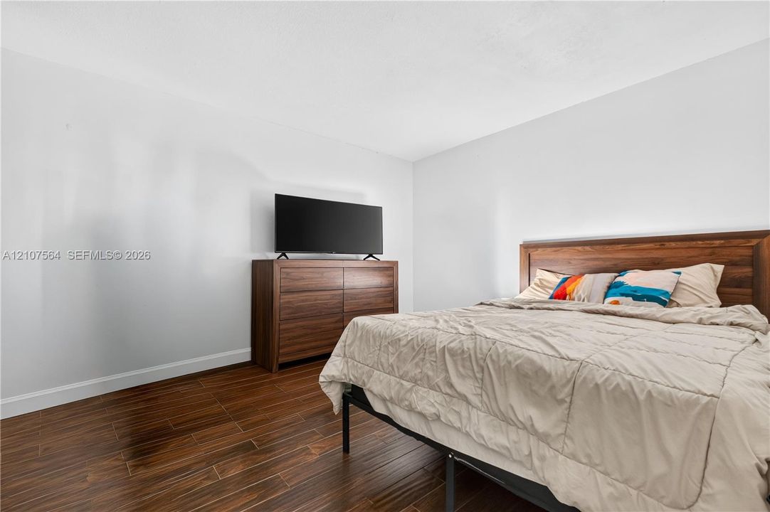 Wood-finish flooring throughout with neutral wall tones
