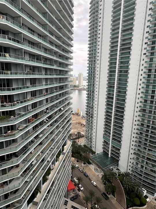 High-rise architecture featuring wrap-around glass railings and expansive private balconies