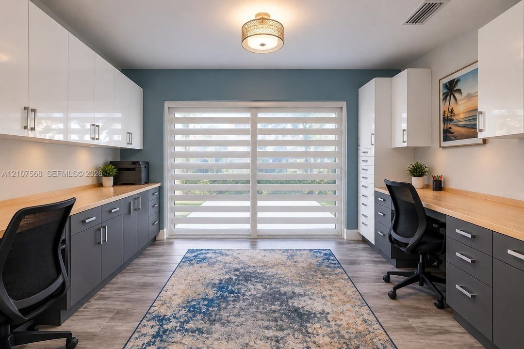 Built-in cabinetry featuring high-gloss white upper doors, matte gray lower drawers, and wood-finish countertops