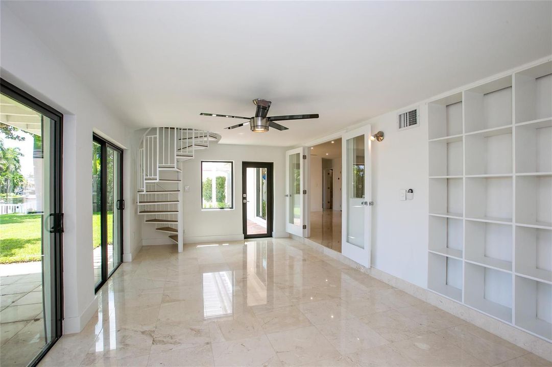 Florida room with spiral stair case