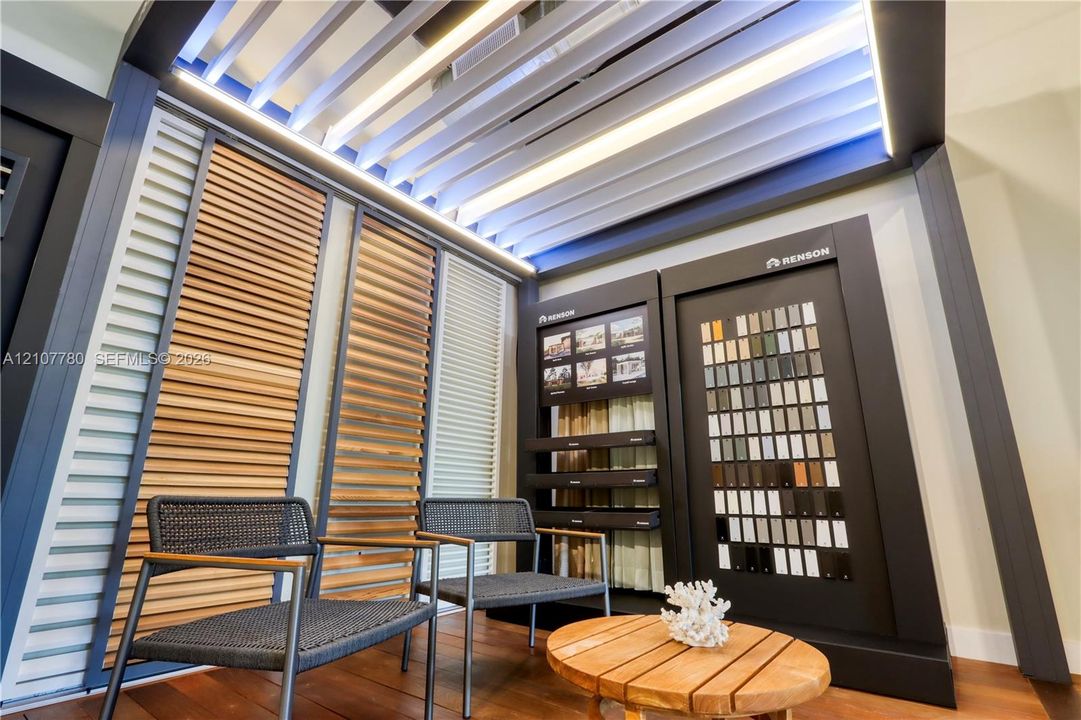 Customizable louvered ceiling system with integrated perimeter lighting, matte-finish metal framing, and vertical wood-slat wall paneling