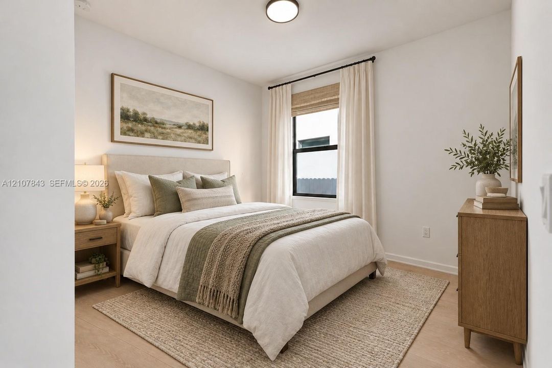 Neutral-toned room featuring wood-finish flooring, a single-pane window with black framing, and a flush-mount overhead light fixture