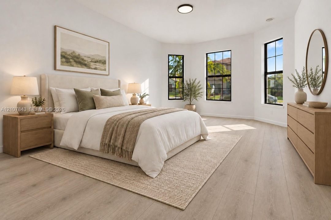 Bedroom featuring wood-finish flooring, three windows with black frames, and a flush-mount ceiling light