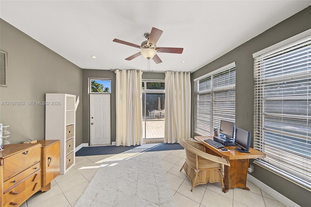 Sun Room with entrance to the pool area