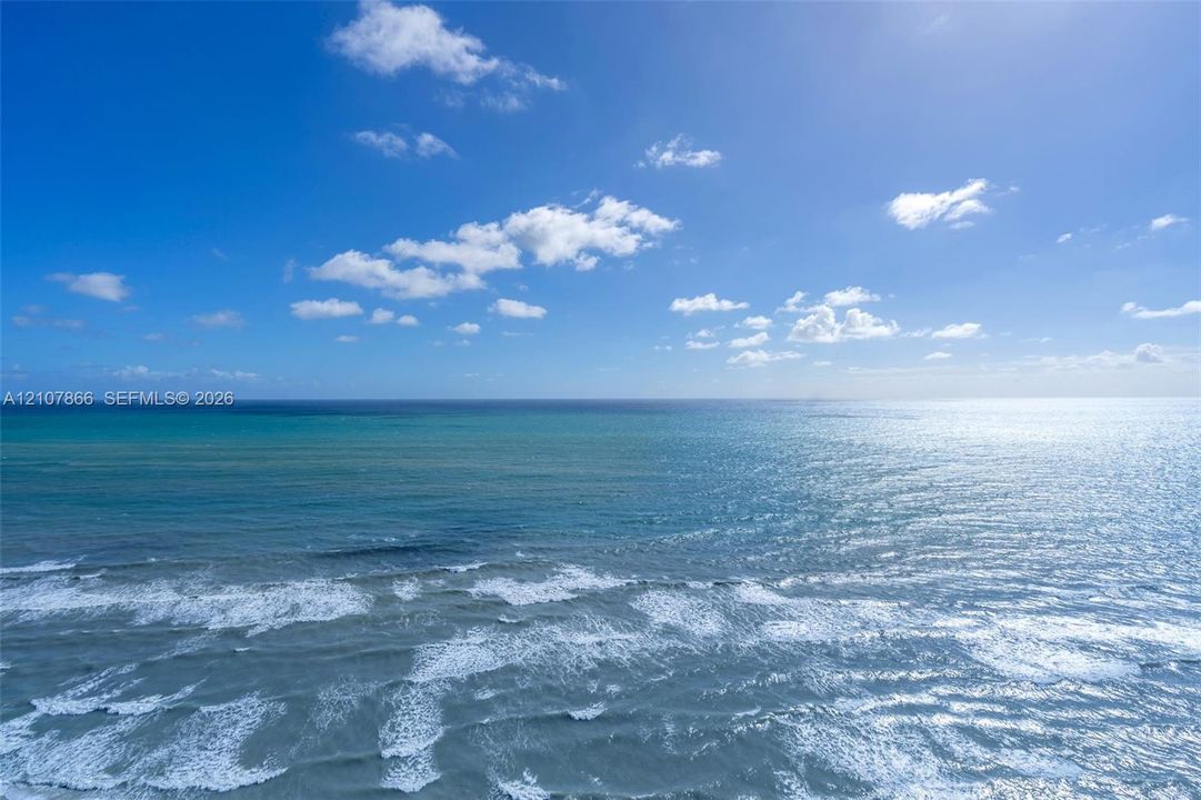 Direct oceanfront exposure with panoramic water and horizon scenery