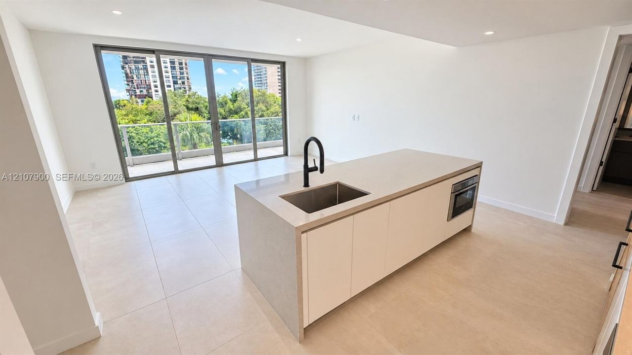 Rooftop amenity deck featuring a swimming pool, separate secondary pool, pickleball court, covered pavilion, and extensive landscaped green spaces