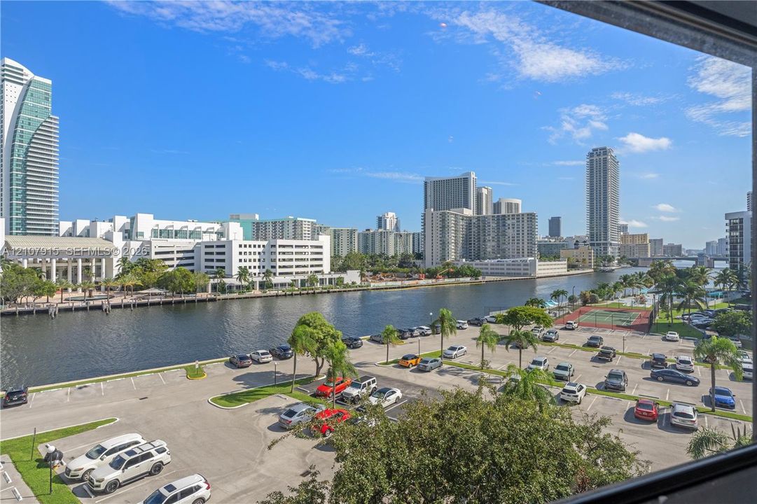 Panoramic cityscape encompassing urban high-rise buildings and an expansive waterway