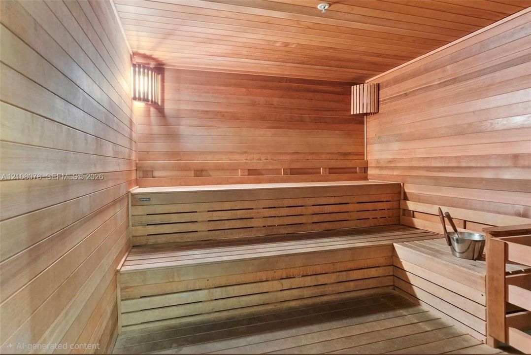 Sauna featuring horizontal wood-plank wall paneling, integrated tiered wooden bench seating, and wall-mounted sconce lighting