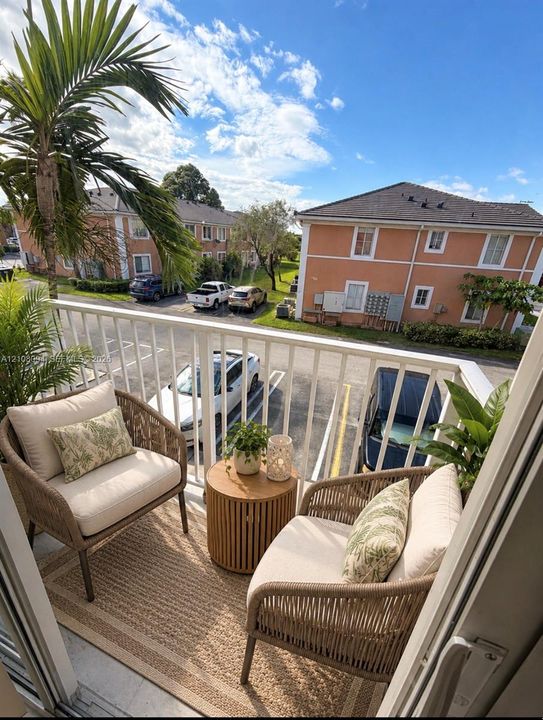 Private balcony featuring a metal railing