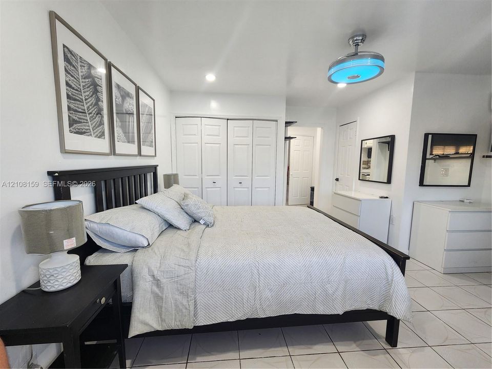 Tile flooring, bi-fold closet doors, and recessed ceiling lighting