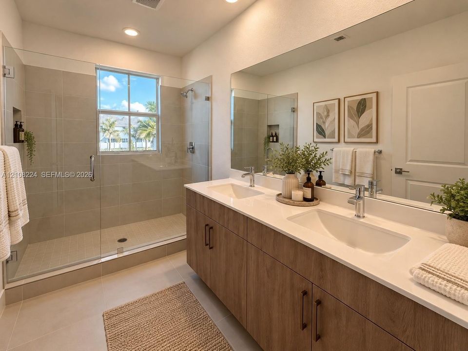 Double vanity with wood-finish cabinetry, quartz countertops, undermount sinks, full-width wall mirror, and a walk-in shower with floor-to-ceiling tile surround and glass enclosure