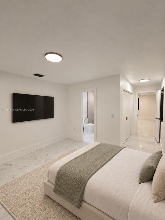 Neutral-toned interior featuring large-format stone-finish tile flooring, flush-mount circular lighting, and double-door closet storage