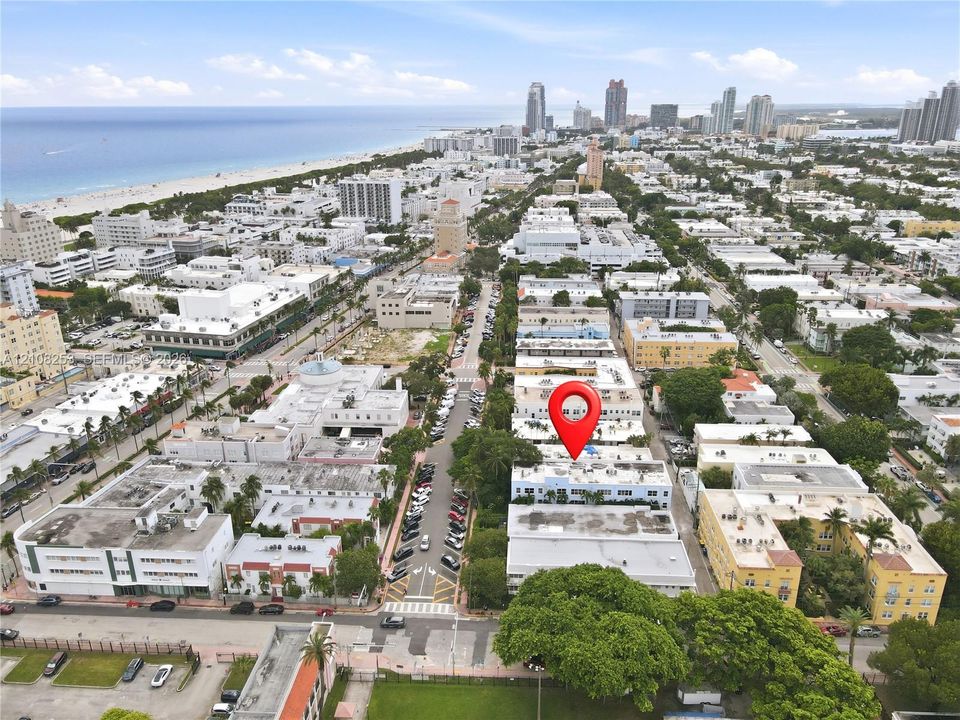 Aerial perspective featuring urban proximity to the coastline, dense metropolitan surroundings, and established street-level infrastructure