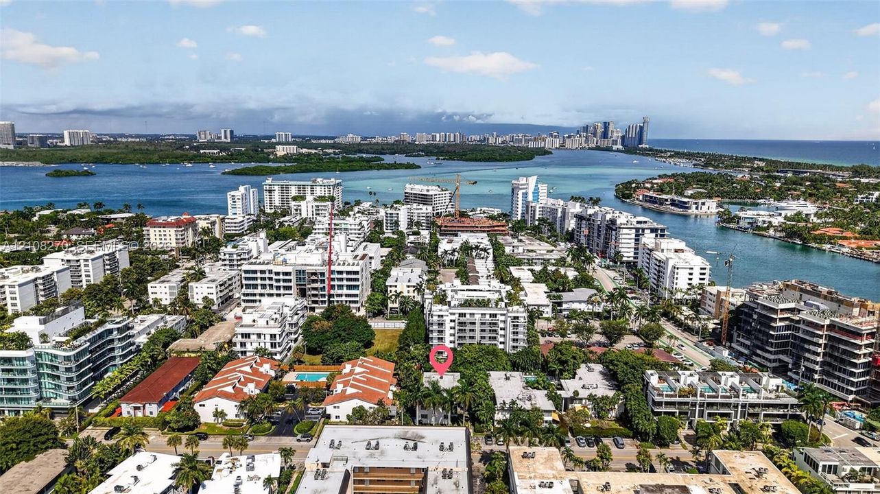 Aerial perspective featuring a waterfront location with immediate access to coastal waterways and dense tropical landscaping