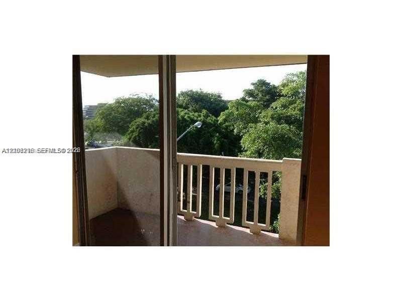 Private balcony featuring a concrete floor, solid masonry wall enclosure, and structural balustrade railing