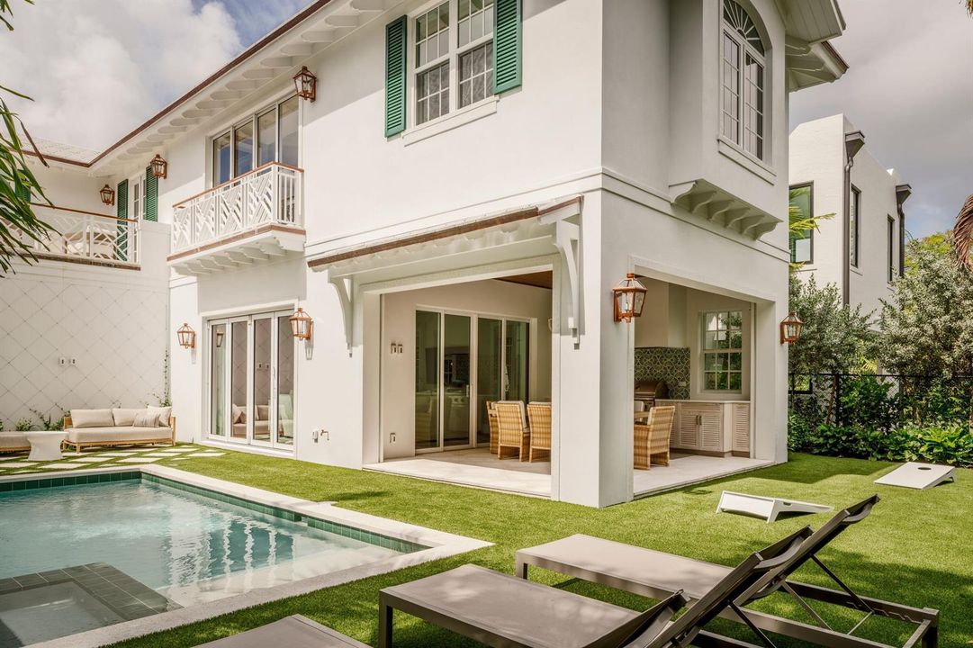 04 - White home exterior with covered pa