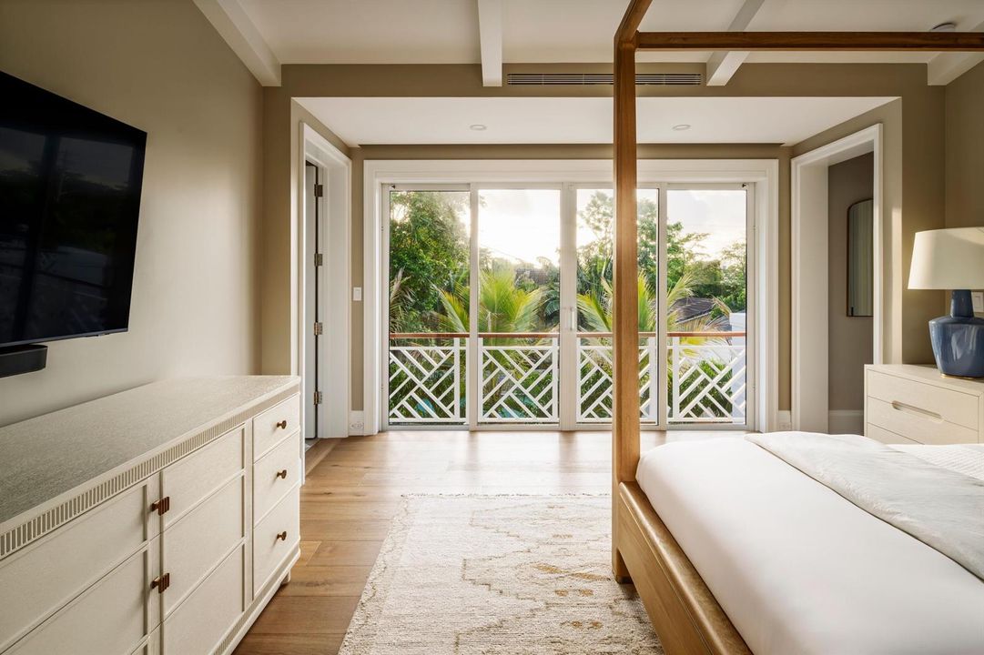 31 - Master bedroom with canopy bed, whi