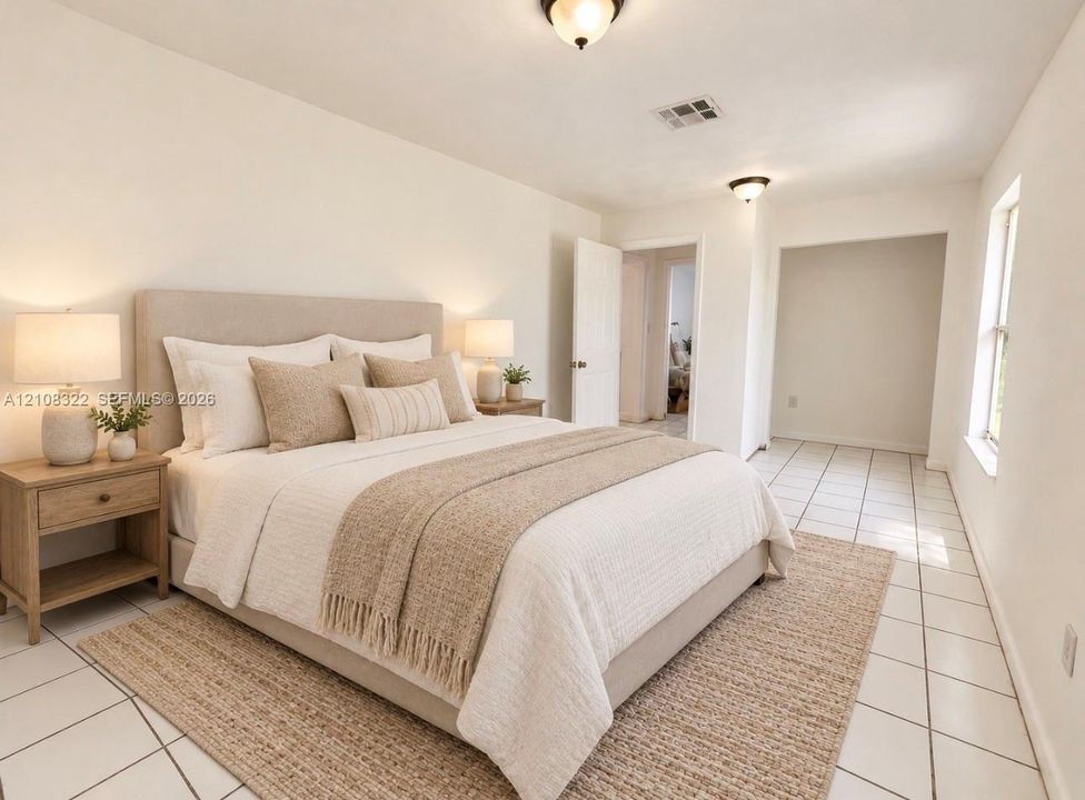 Neutral-toned interior space featuring light-colored ceramic tile flooring, dual flush-mount ceiling light fixtures, and natural light via a single-pane window