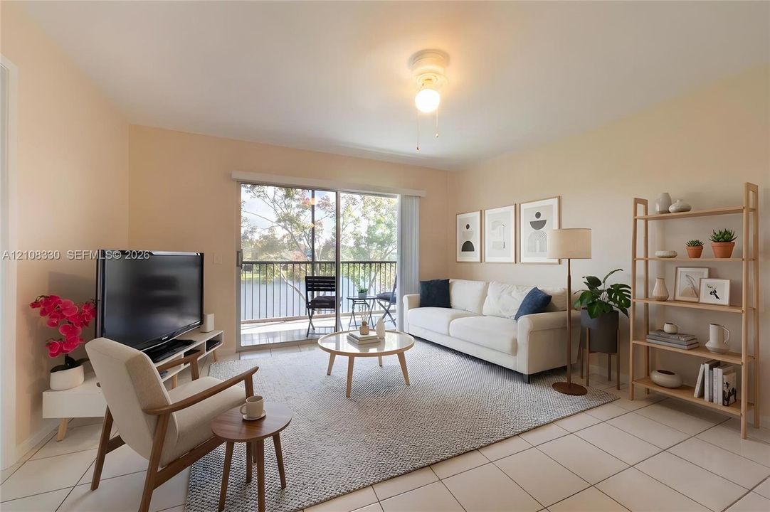 Neutral-toned tile flooring, flush-mount ceiling lighting, and sliding glass doors leading to an exterior balcony