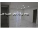 Interior space featuring recessed lighting, polished stone flooring, and sliding glass doors