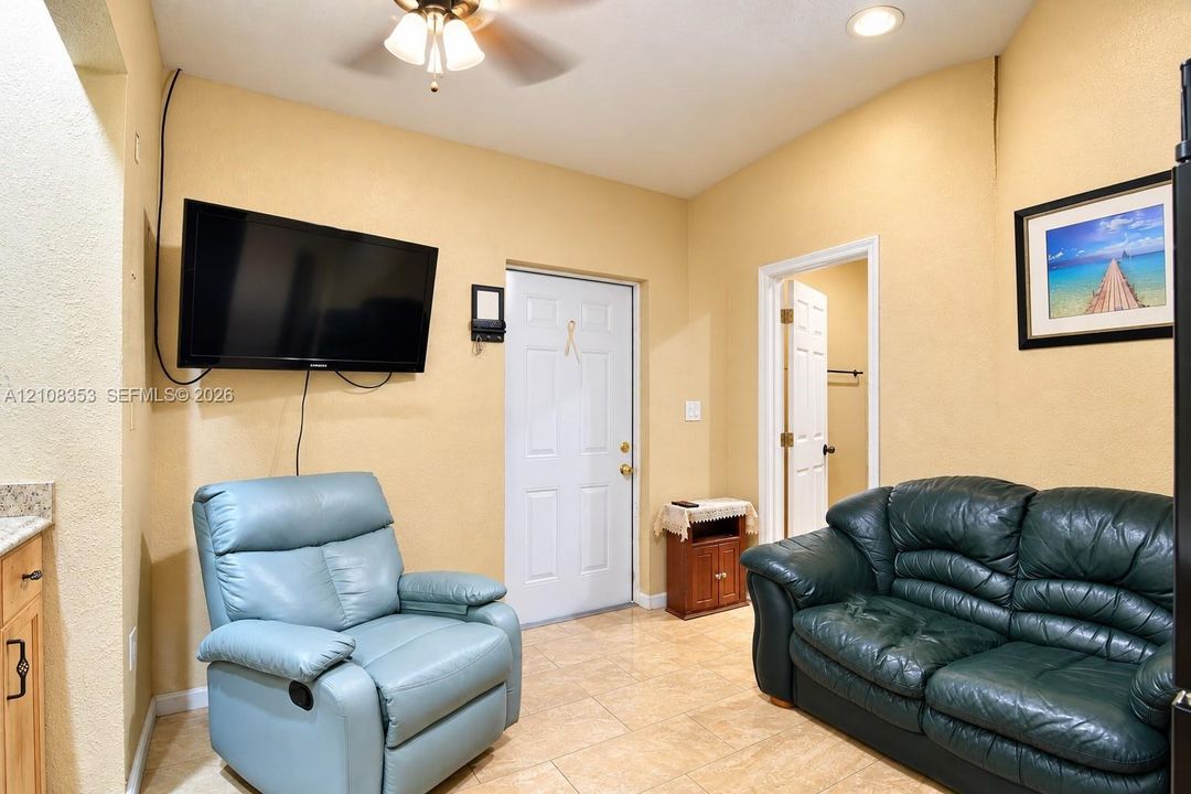In-Law Living Room with fan with integrated lighting