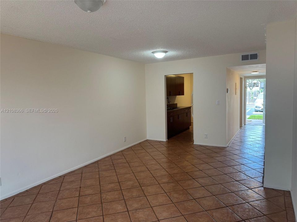 Ceramic tile flooring, neutral wall tones, and recessed ceiling lighting