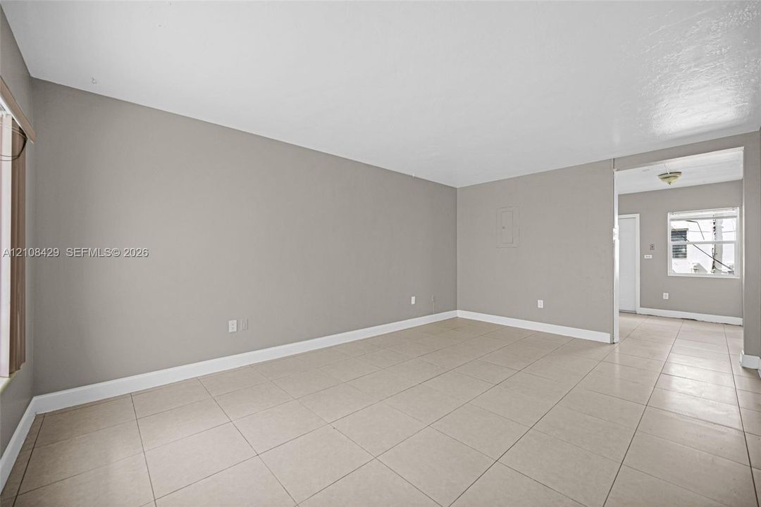 Neutral interior featuring ceramic tile flooring, smooth-finish walls, and a recessed ceiling lighting fixture