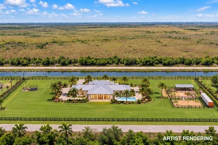 Expansive residential acreage featuring a swimming pool, covered outdoor structure, landscaped perimeter, and metal roof system