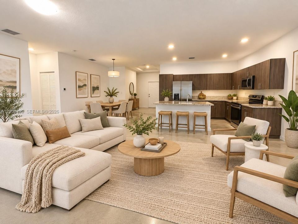 Open-concept kitchen featuring dark wood-finish cabinetry, stone countertops, and a central island with bar seating, complemented by recessed lighting and polished concrete flooring